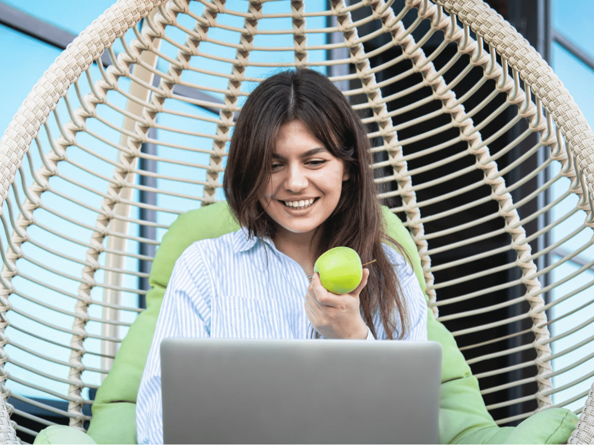 A white-collar worker uses an employer health portal to learn about healthy eating habits.